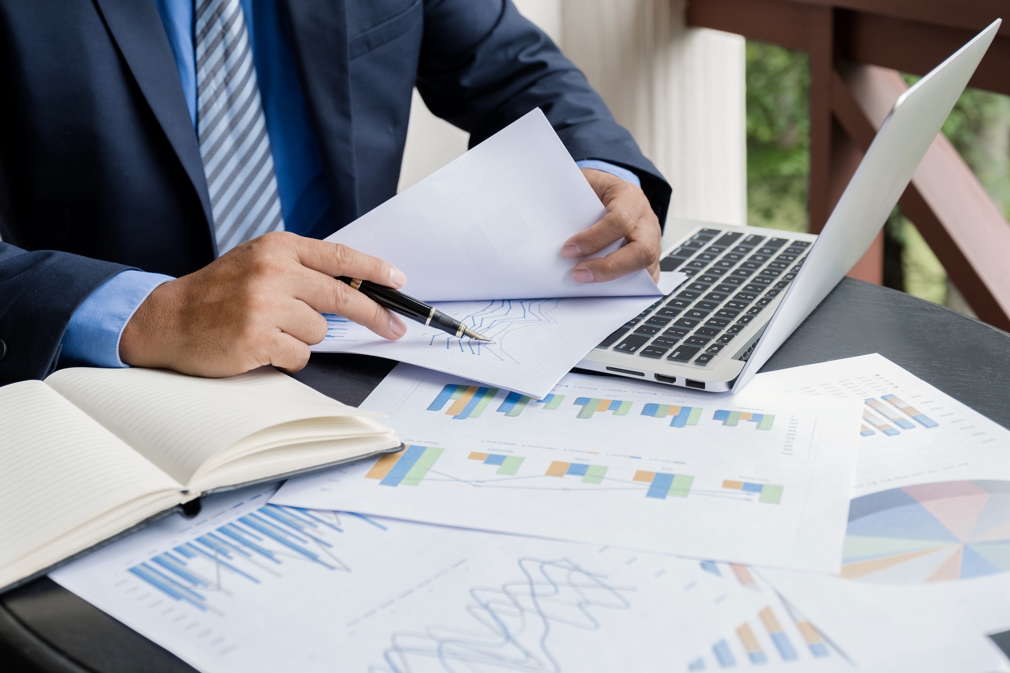 businessman-hand-holding-pen-analysis-the-graph-with-laptop-at-the-home-office.jpg businessman-hand-holding-pen-analysis-the-graph-with-laptop-at-the-home-office.jpg